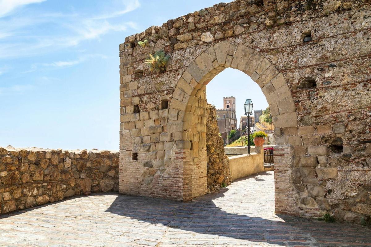 an archway in an old stone wall