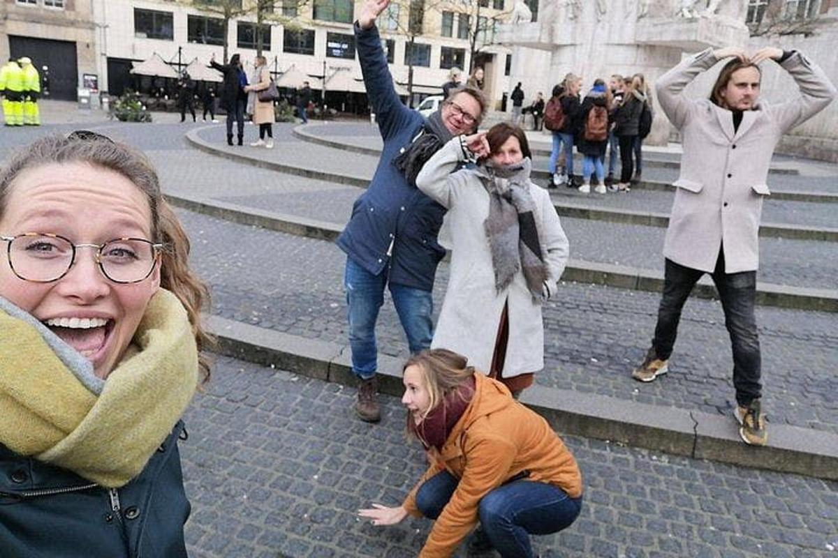 a group of people standing around on a street