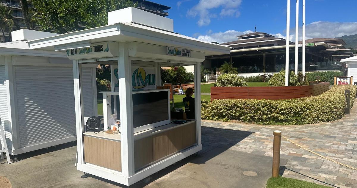 a small food stand in front of a building