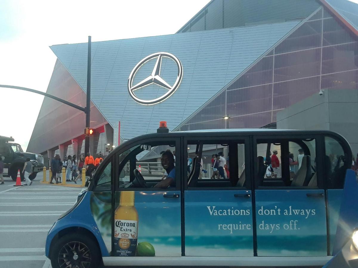 a small car parked in front of a building