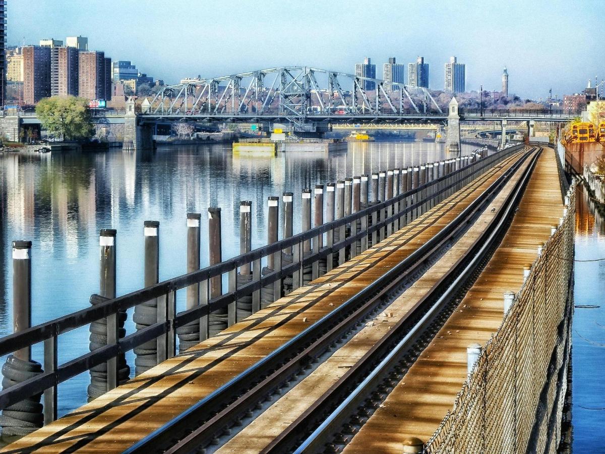 a bridge over the water next to a river