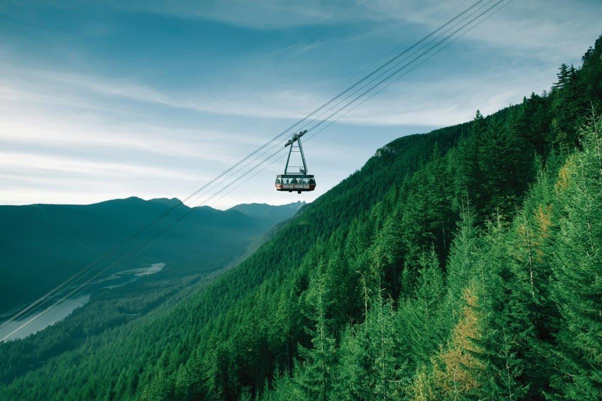 a ski lift in the middle of a mountain