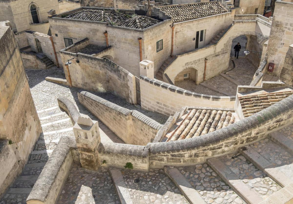 an aerial view of an old building with roofs