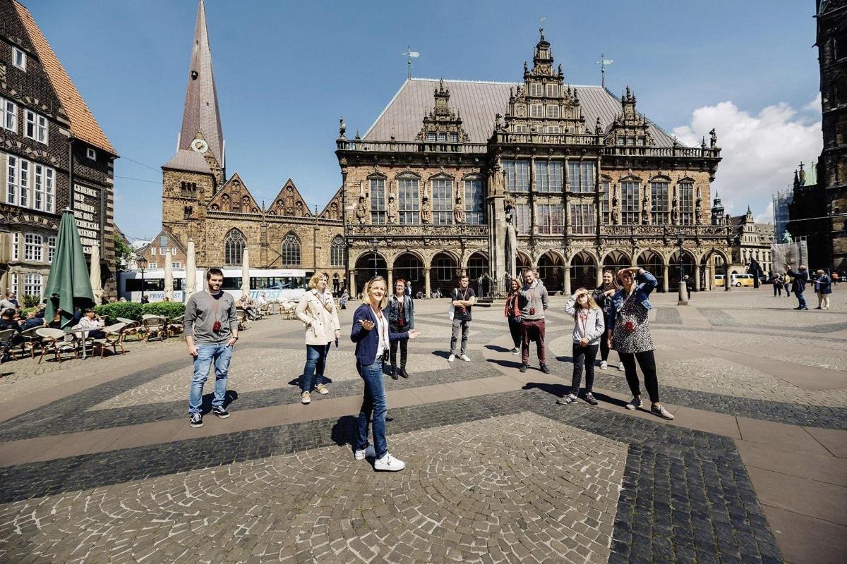 a group of people standing in front of a building