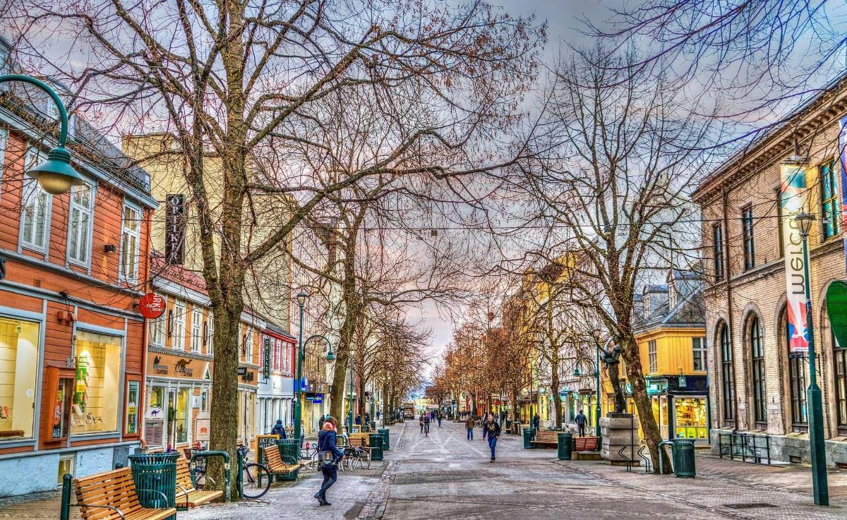 a city street with people walking down the street