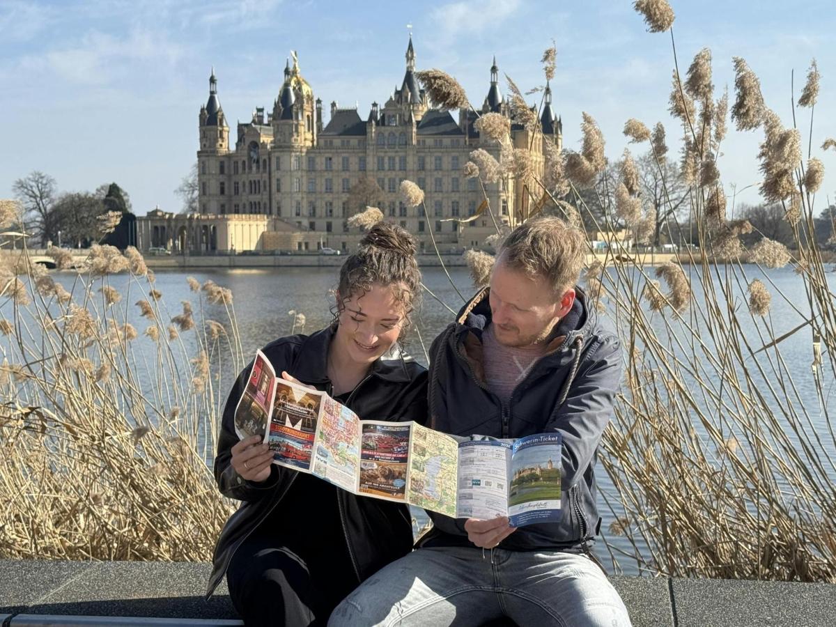 a man and a woman looking at a map