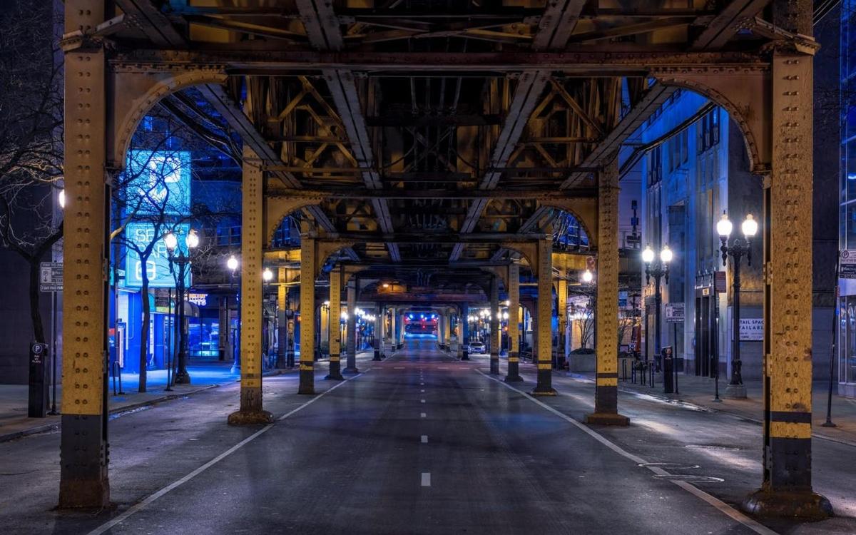 an empty street at night with lights on