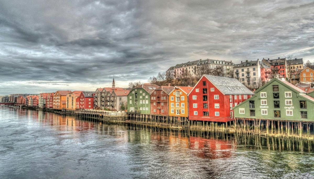 a group of colorful buildings next to a river