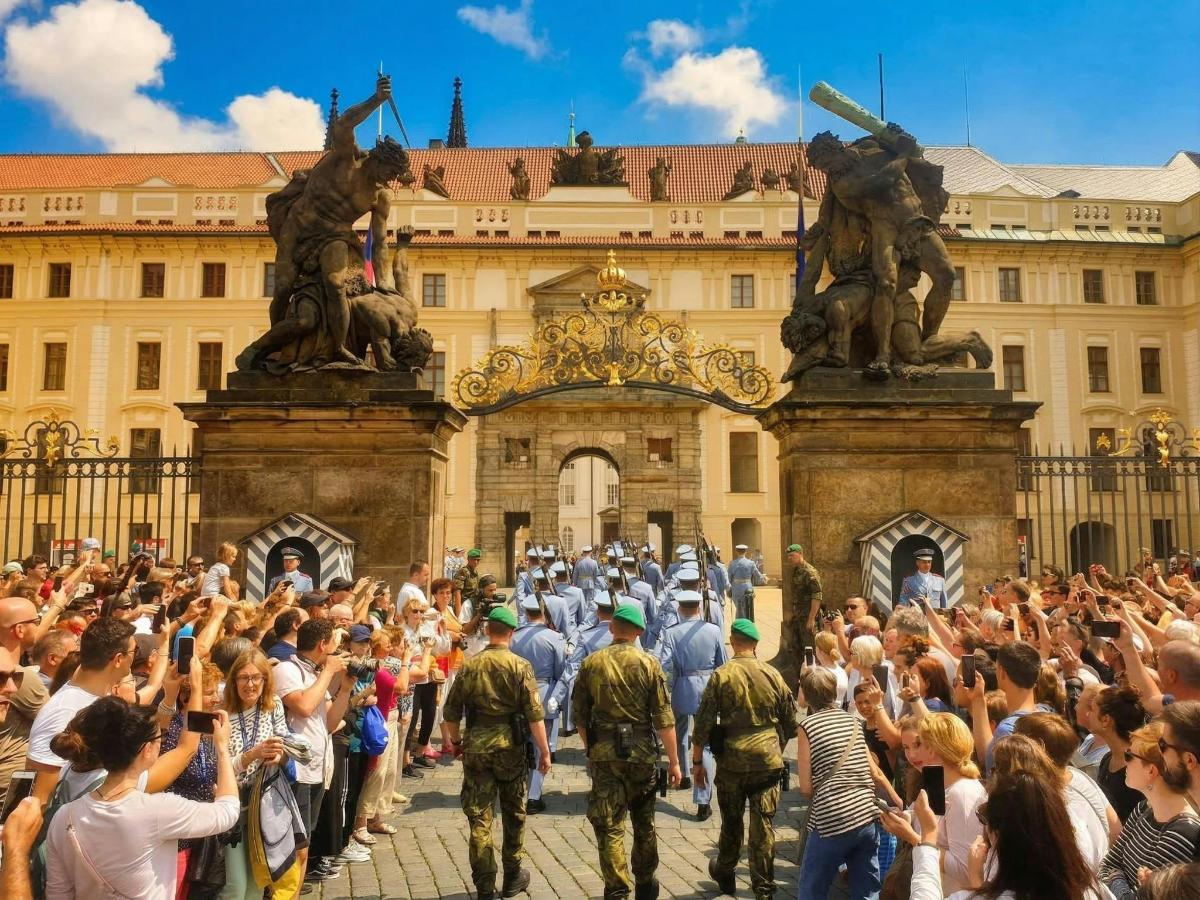 a large crowd of people standing in front of a building