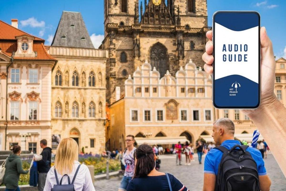 a person holding up a cell phone to take a picture of a building