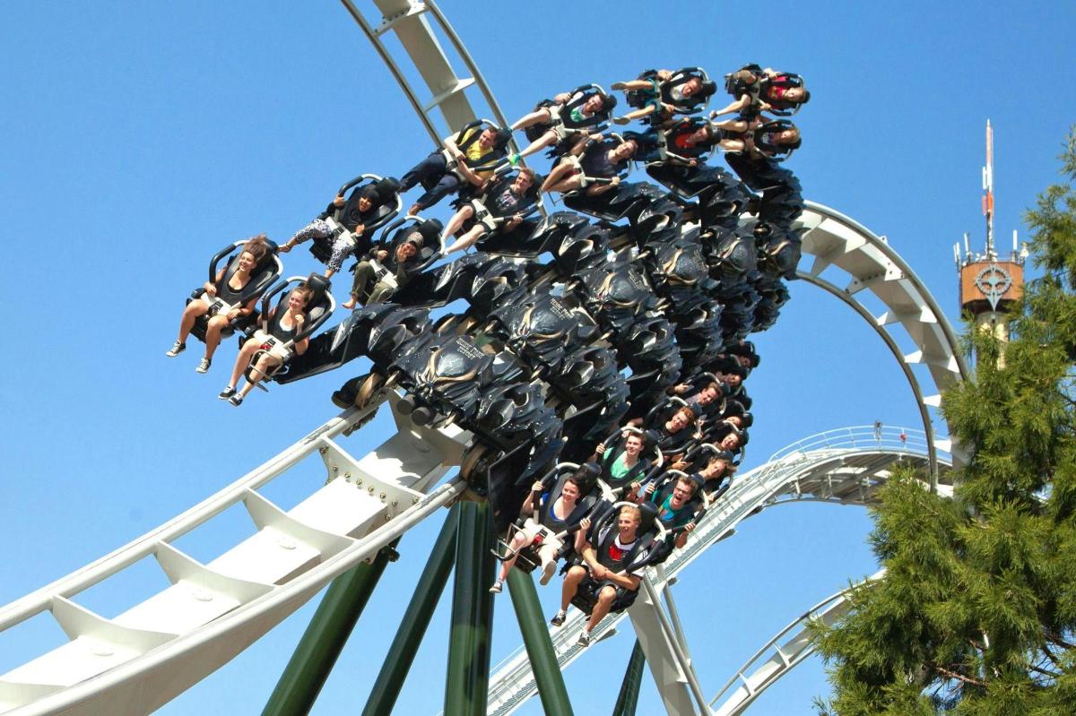 a group of people riding on a roller coaster