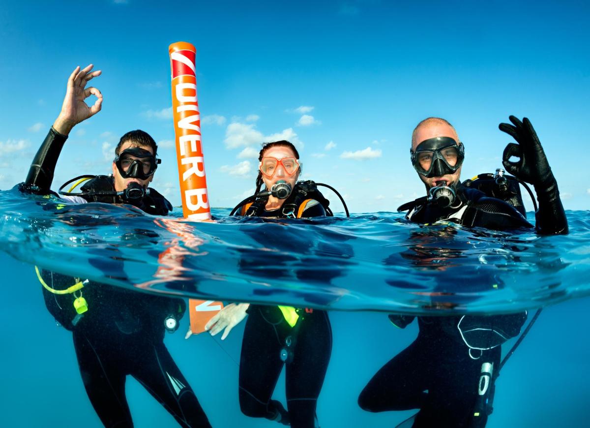a group of three people in the water