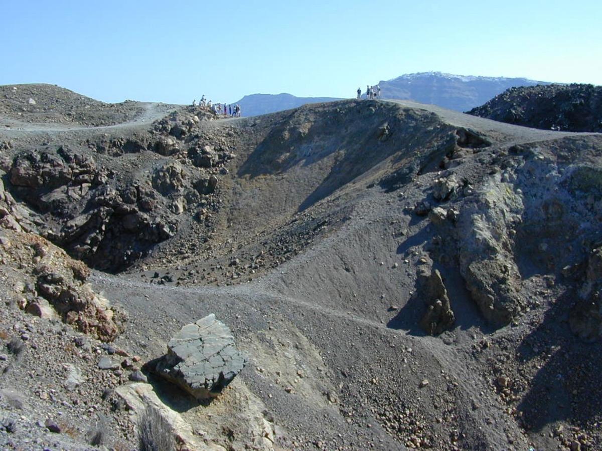 a view of a mountain with rocks andgrass