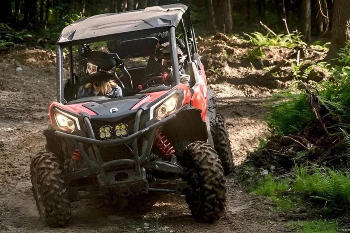 a person riding a atv on a dirt road