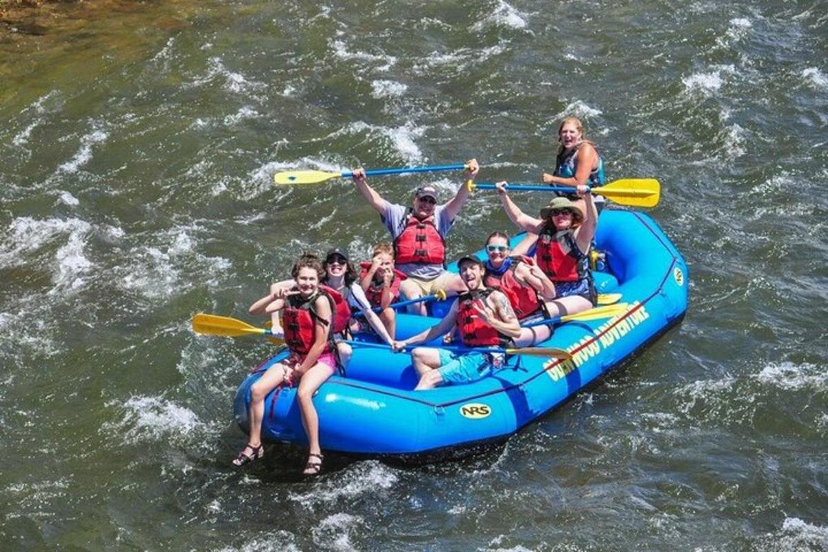 a group of people on a raft in the water