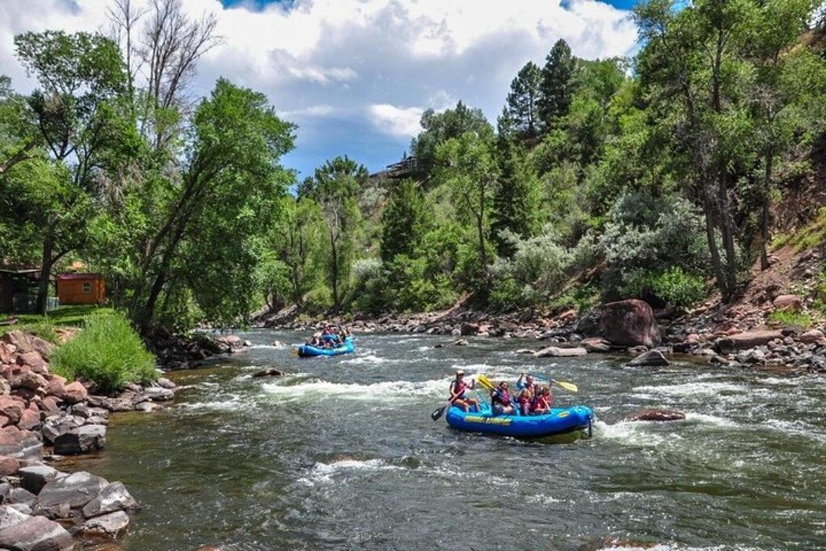 a group of people are rafting down a river