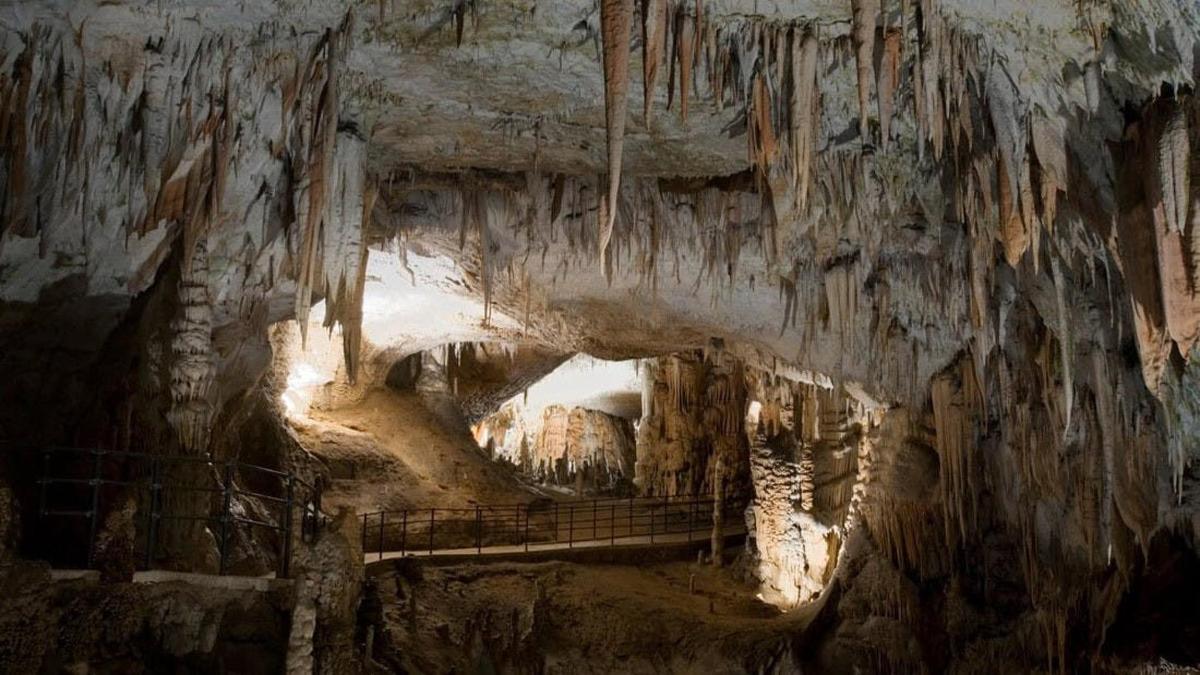 a cave with a bridge in the middle of it