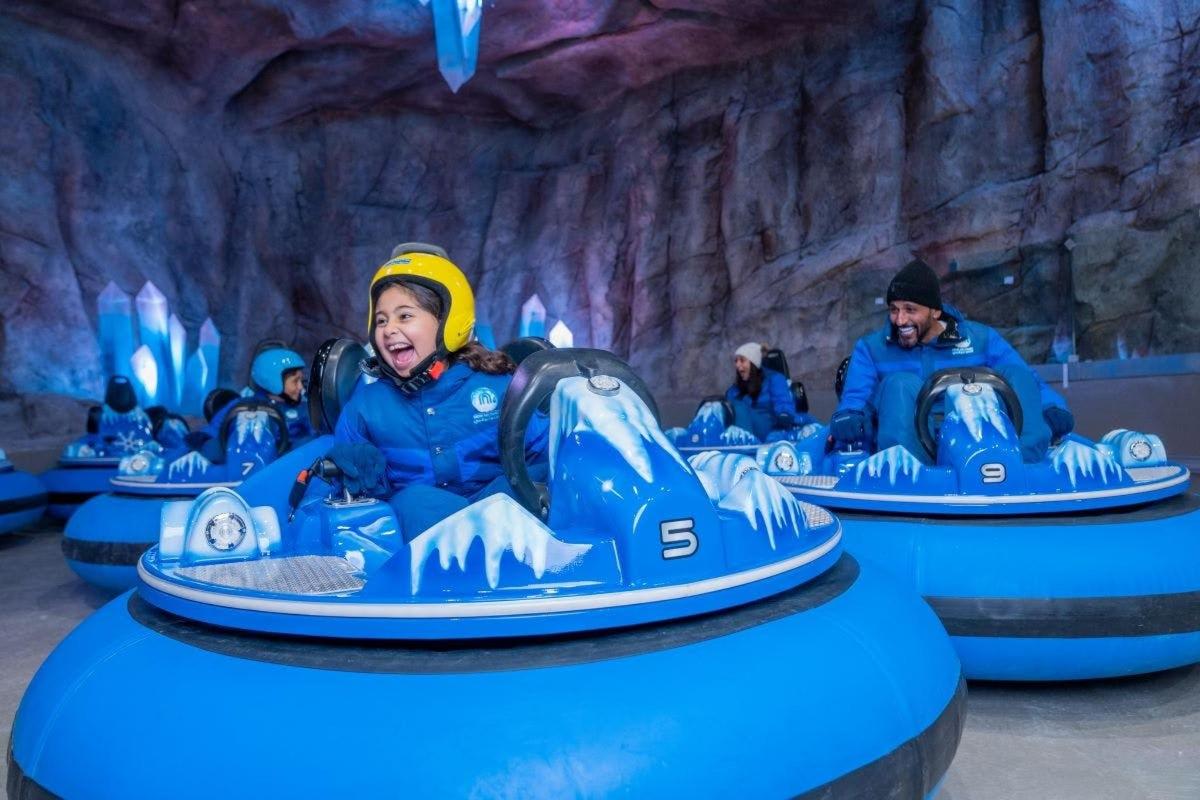 a group of people riding on a roller coaster