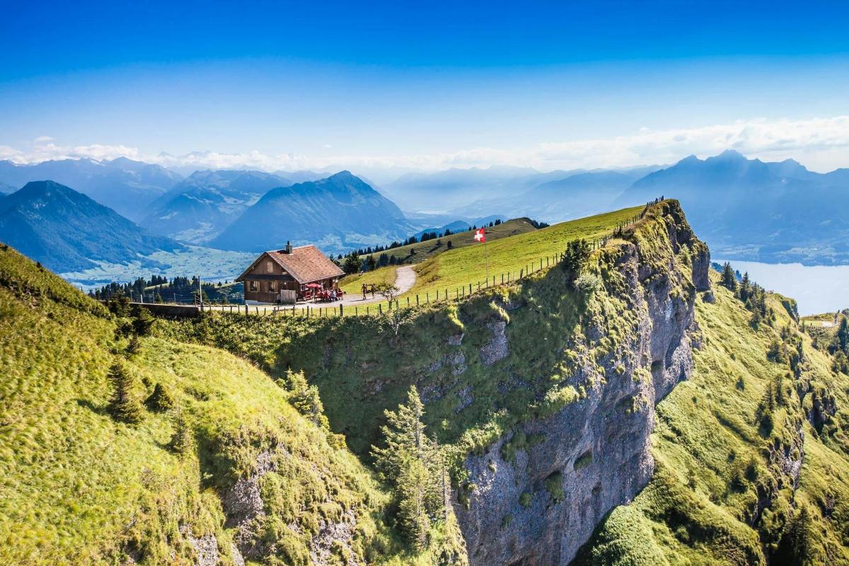 a house on the edge of a mountain