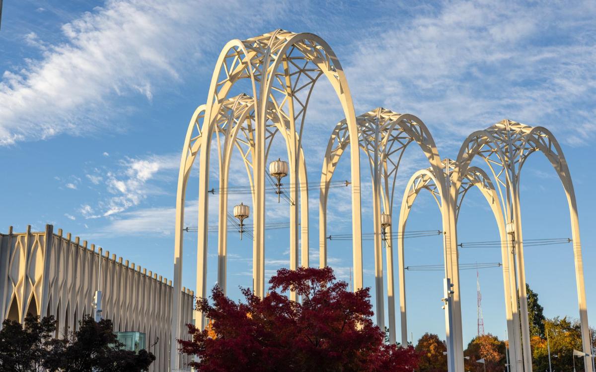 a group of metal structures in front of a building