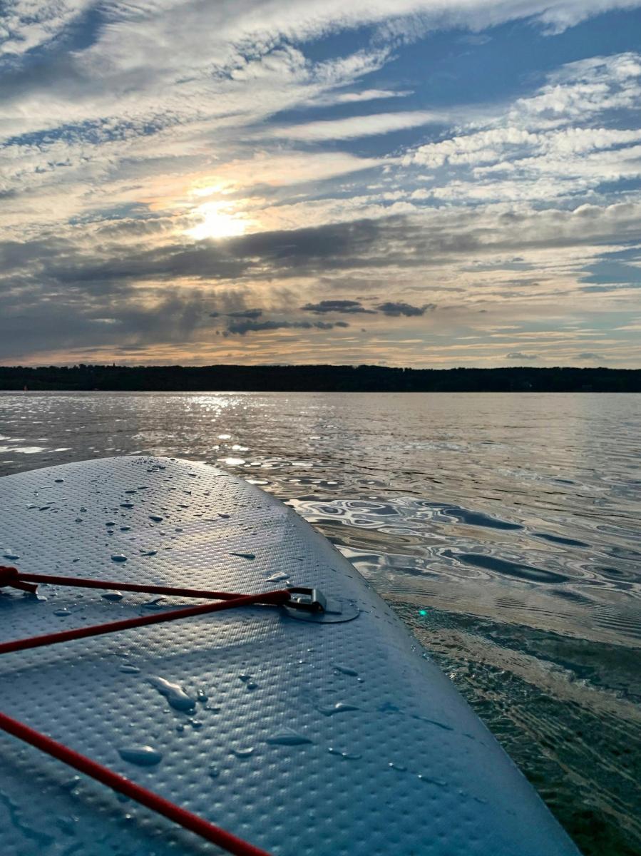 a view of the end of a boat on the water