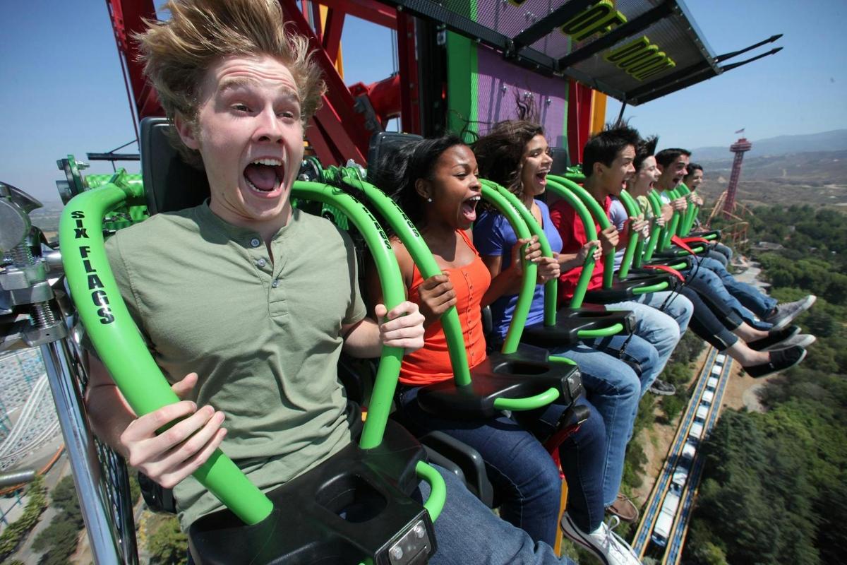 a group of people riding a roller coaster