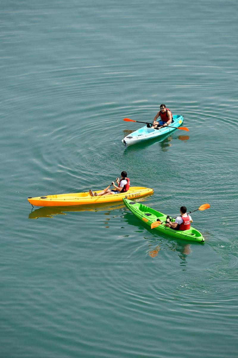 a group of people in kayaks in the water