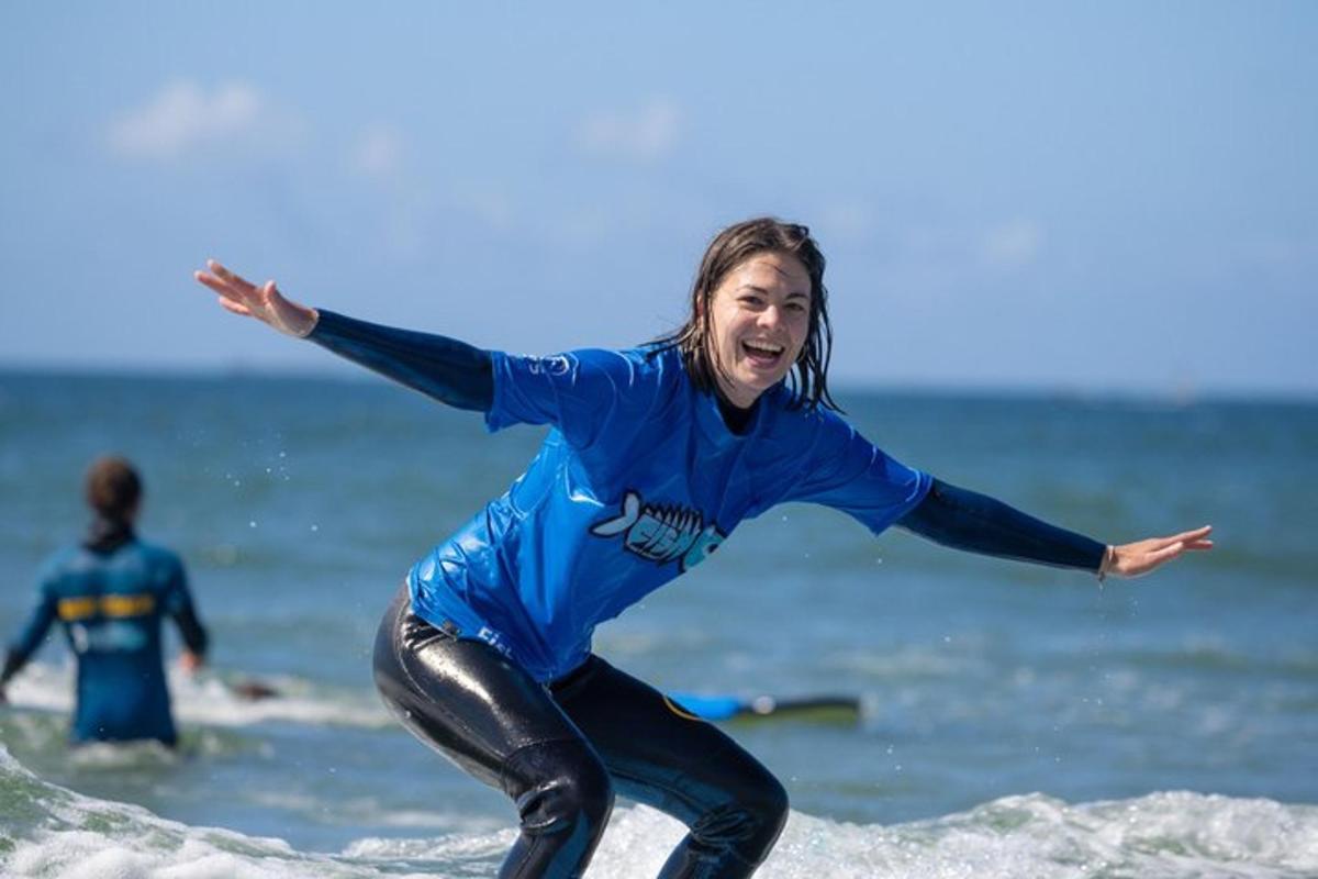 a woman riding a wave on a surfboard in the ocean