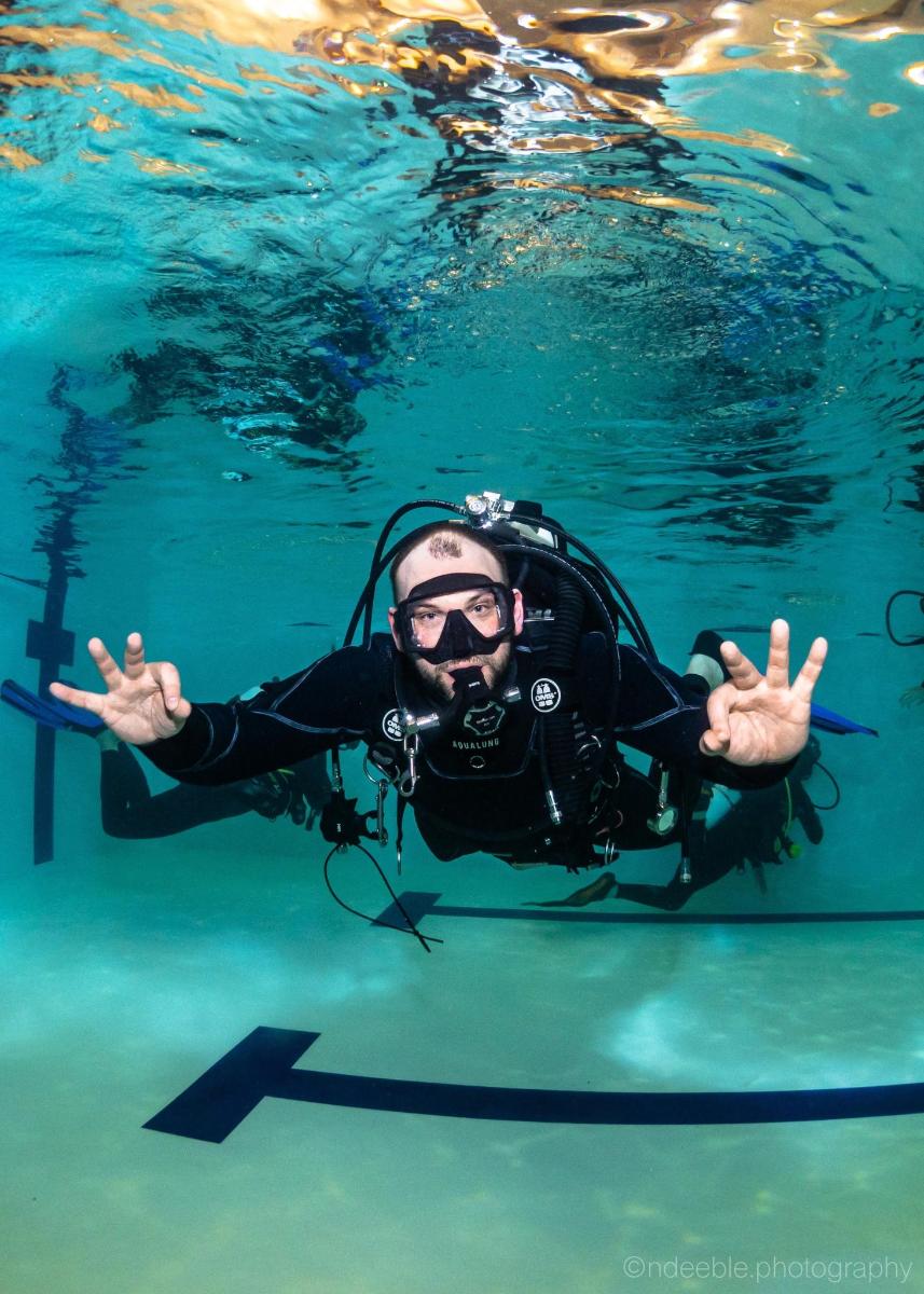 a man is swimming in the water
