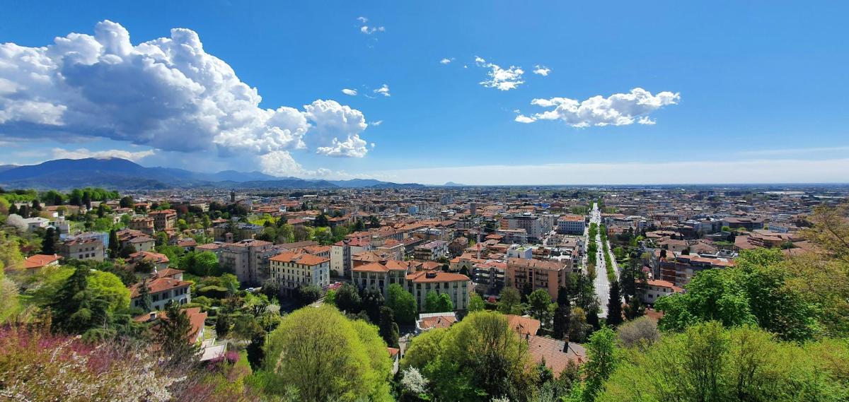 a view of a city with buildings and a fountain