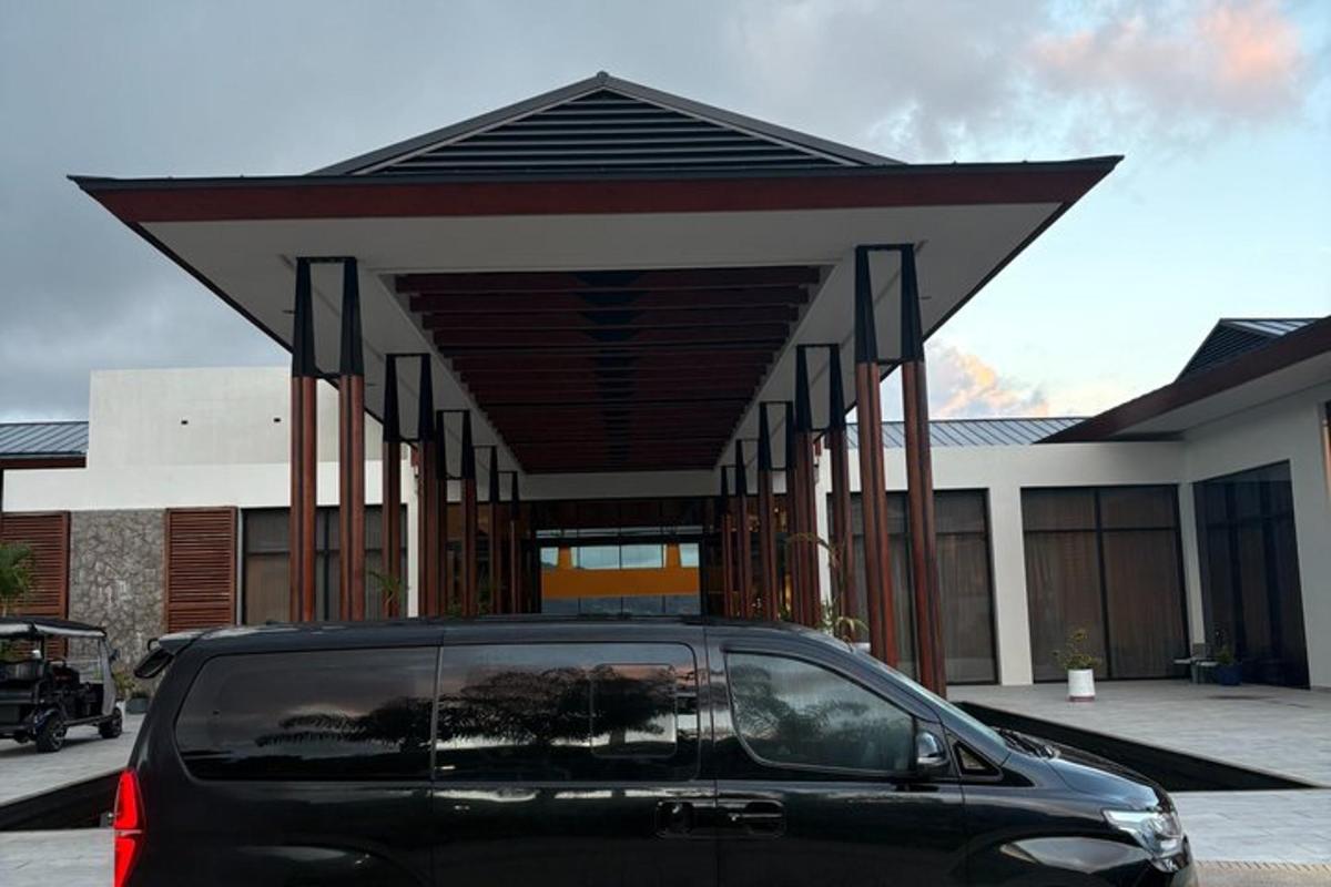 a car parked in a parking lot in front of a building