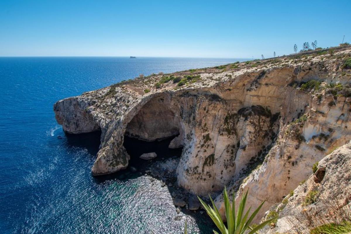 a large rock formation in the middle of the ocean