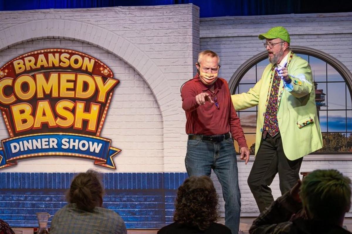 two men standing on a stage with microphones