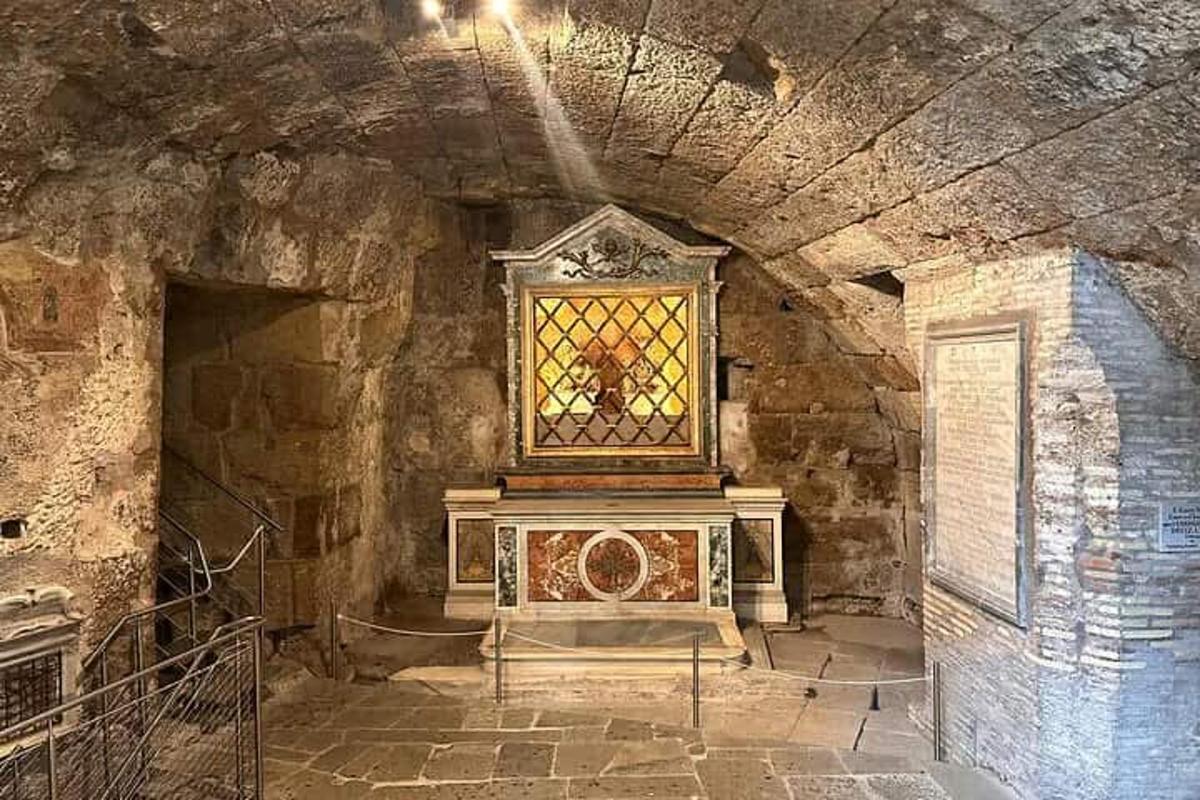 a room with a stained glass window in a stone wall