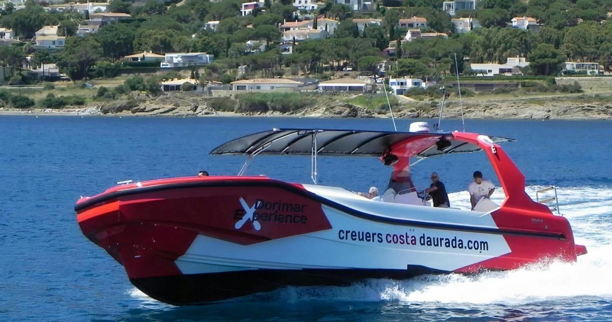 a red and white boat in the water