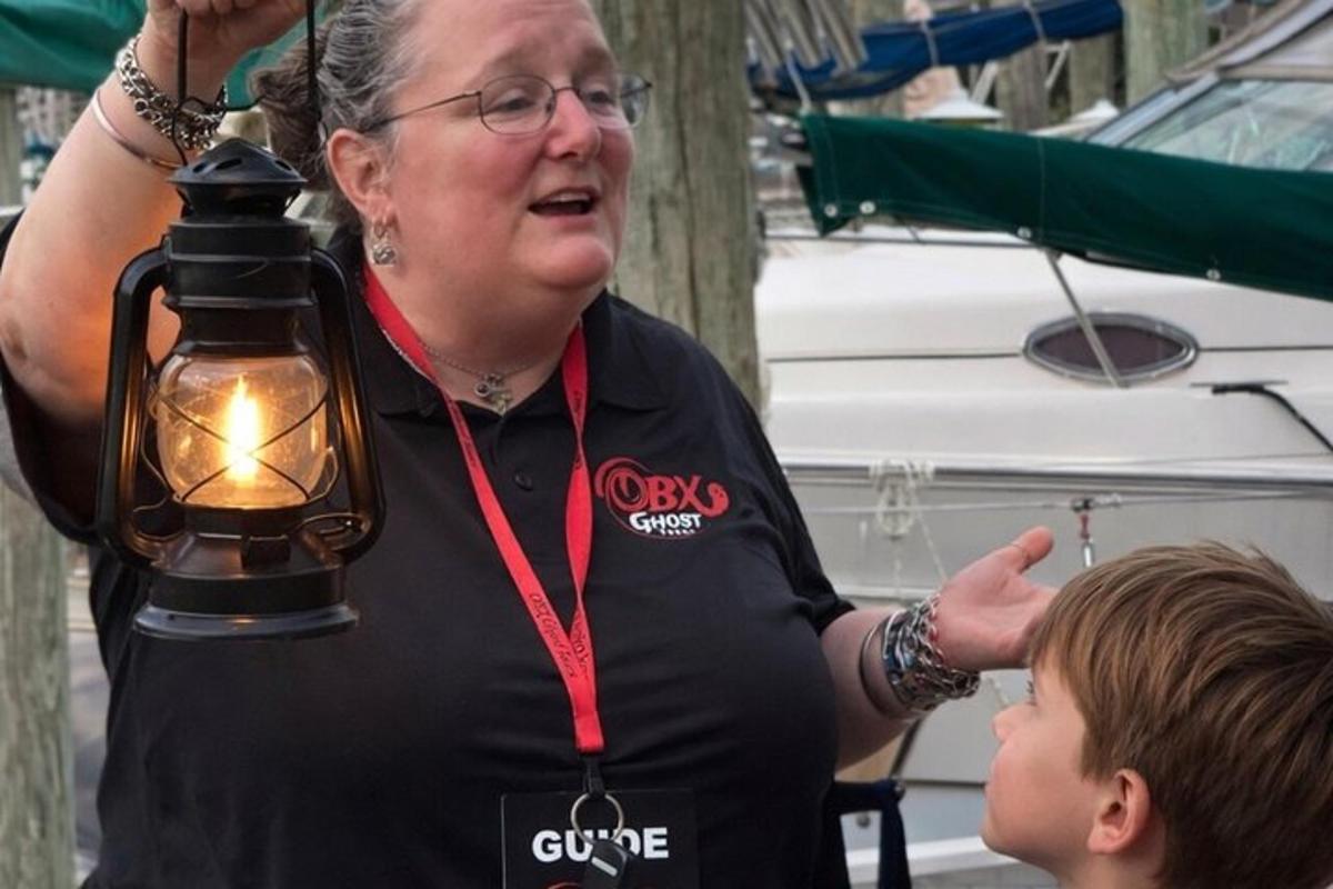 a woman with a light on top of a boy