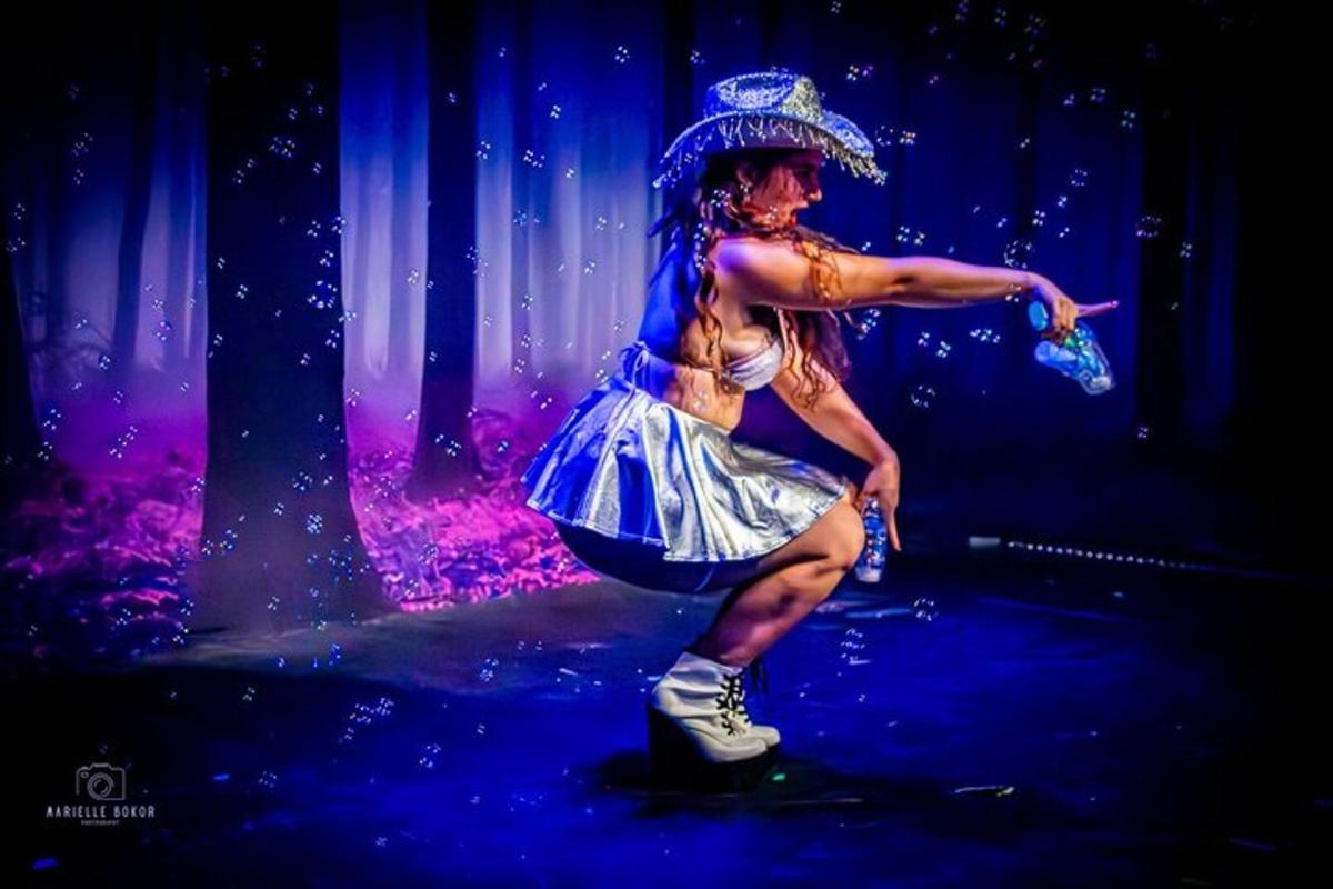 a woman in a costume on a stage