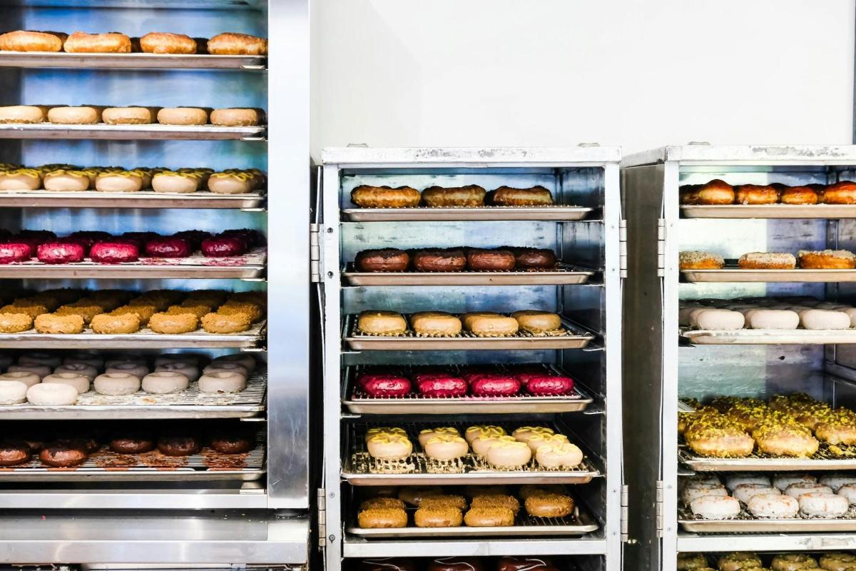 a refrigerator filled with lots of different types of donuts