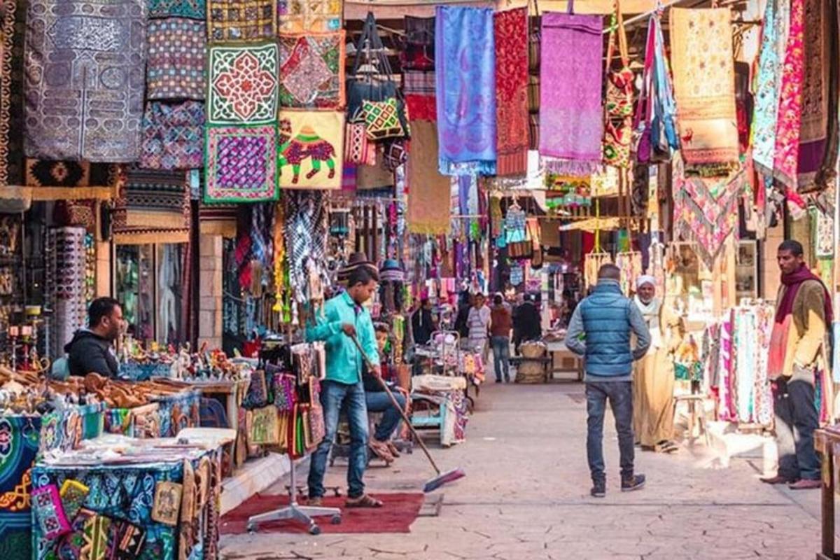 a group of people walking through a market with items