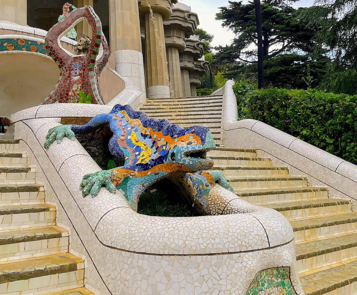 a statue of a dragon on a set of stairs