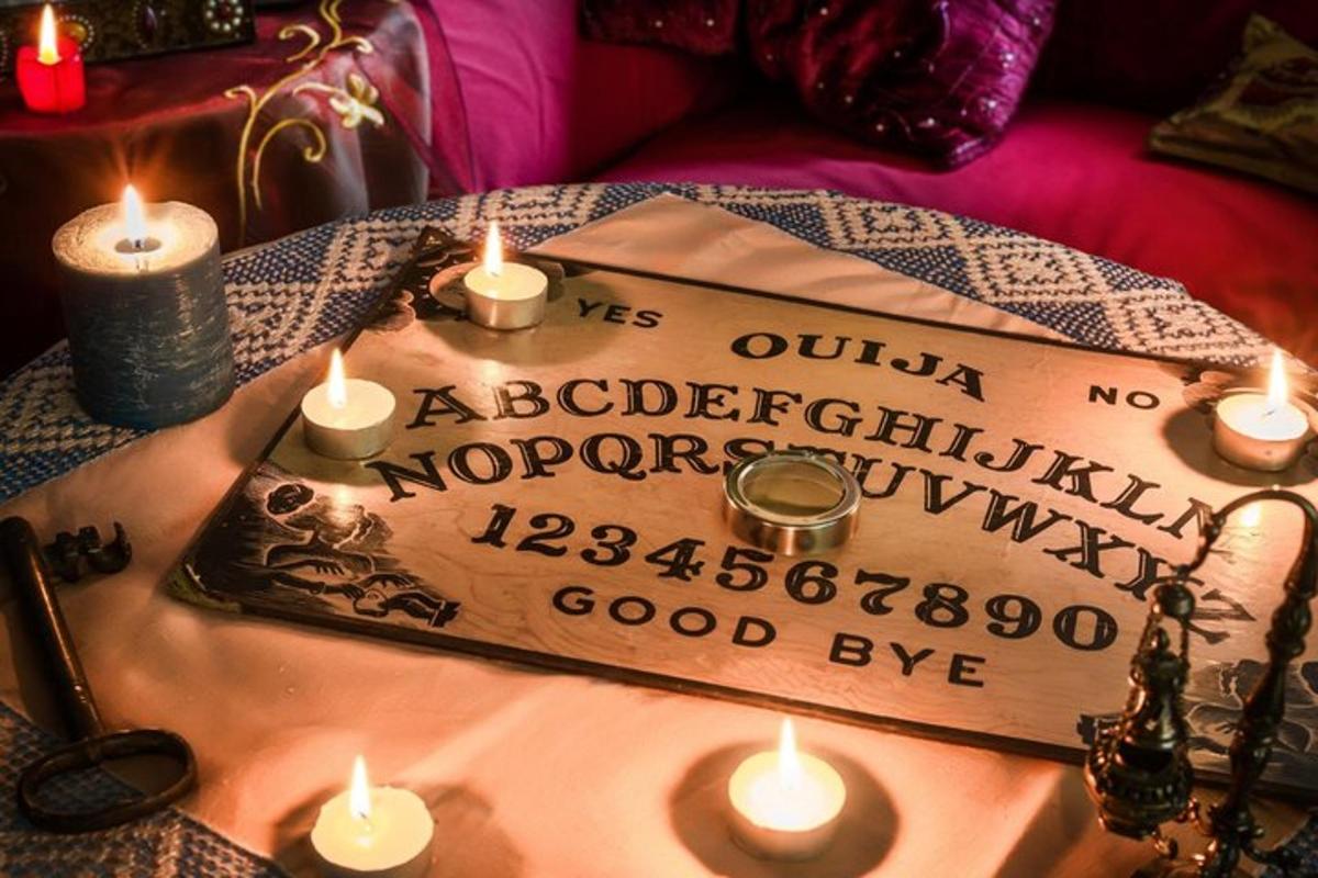 a table with a sign with candles on it