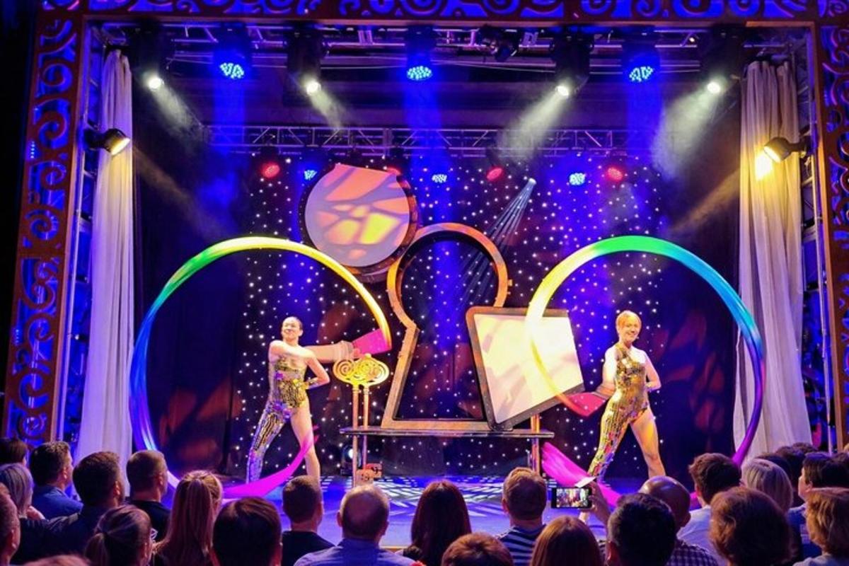 a group of performers on stage in front of a crowd