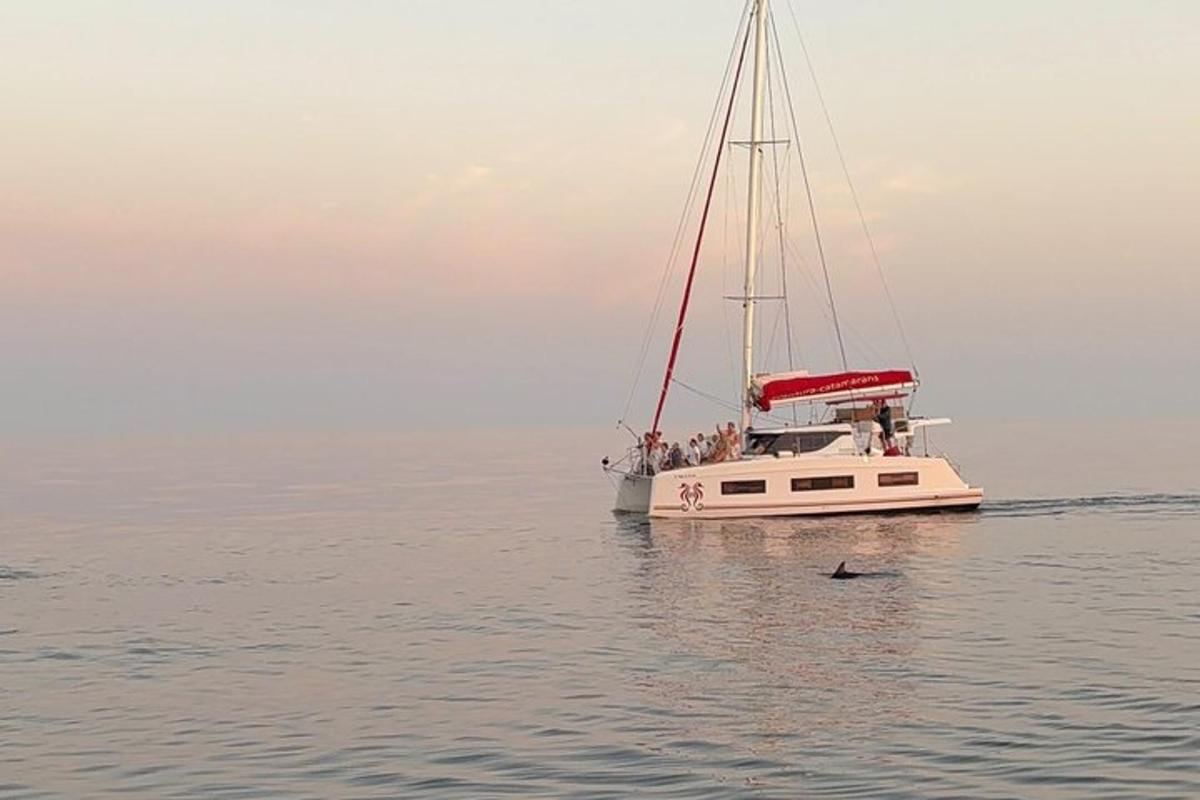 a boat with a group of people on it in the water