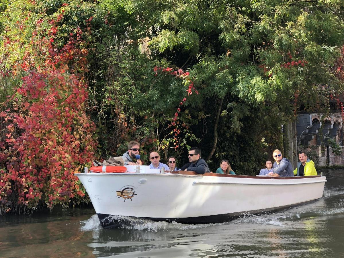 a group of people riding in a boat on the water