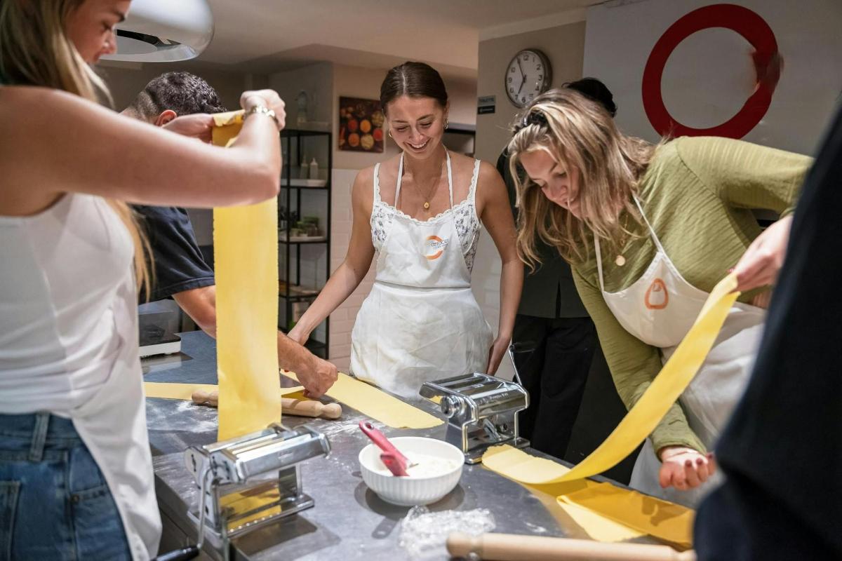 a group of women in a kitchen preparing food