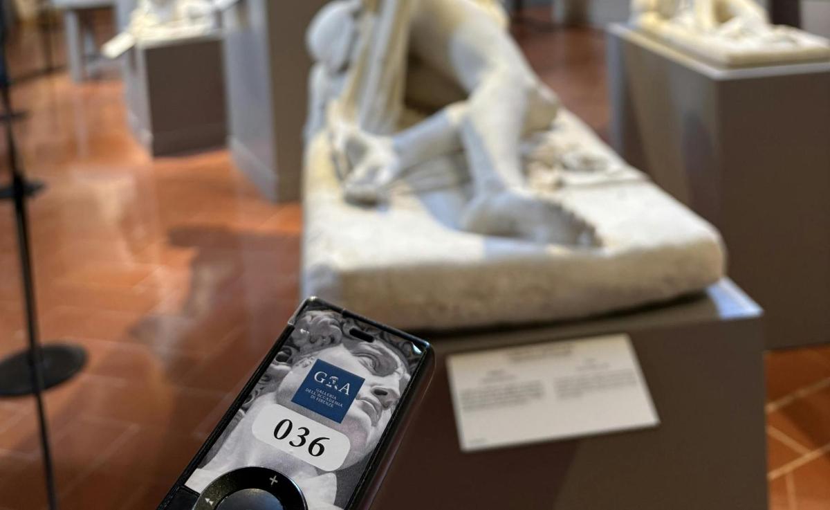 a cell phone on a display in a museum