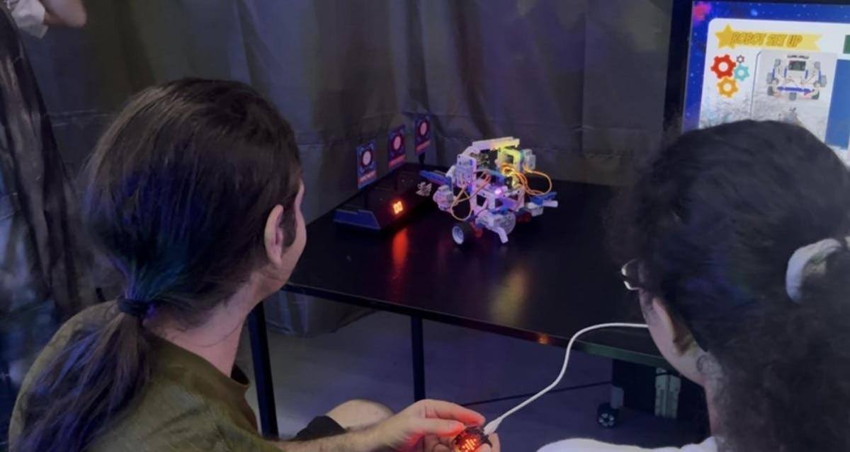 two women playing a video game on a wii