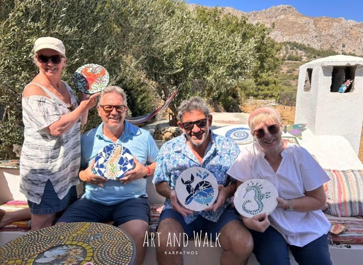 a group of people posing for a picture with frisbees