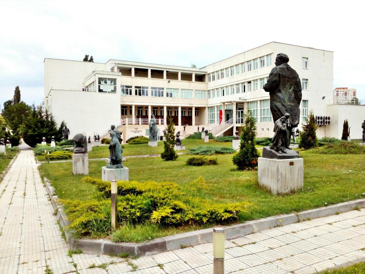 a group of statues in front of a building
