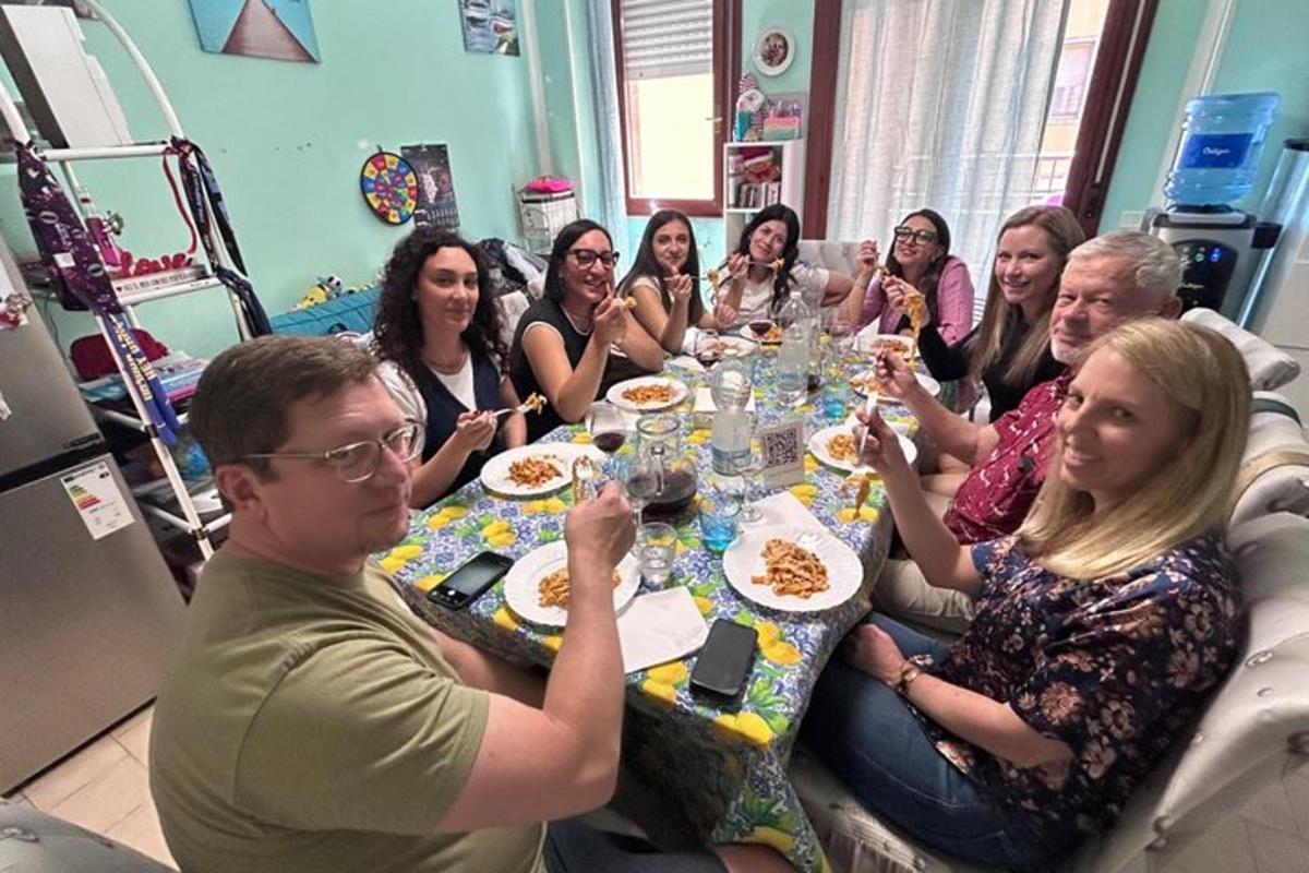 a group of people sitting around a table eating
